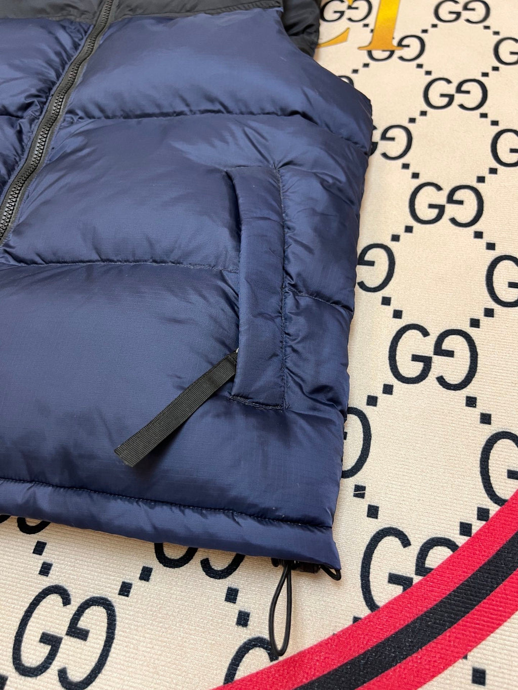 The North Face Puffer Vest in Navy and Black with Stand Collar