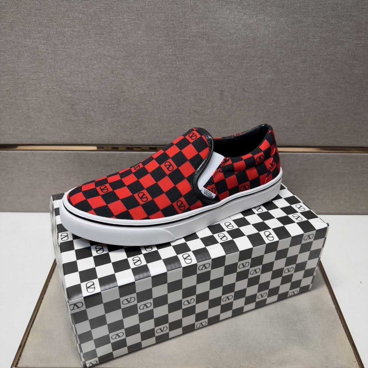 Vans Red and Black Checkerboard Slip-On Sneakers